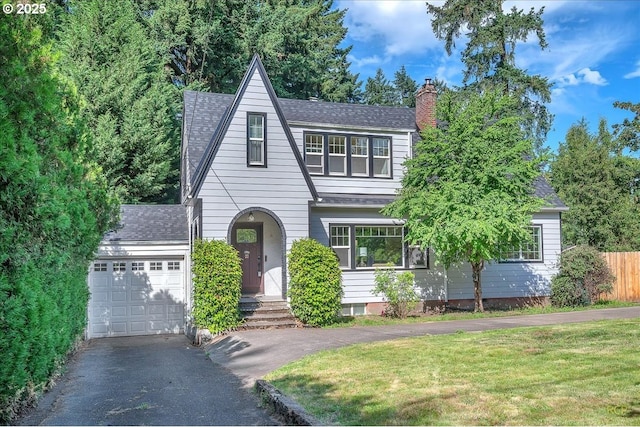 3700 NE Maywood Pl, Portland, OR 97220 - view of front facade with driveway, a chimney, roof with shingles, and an attached garage
