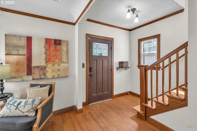 3700 NE Maywood Pl, Portland, OR 97220 - foyer entrance featuring baseboards, wood finished floors, stairs, and ornamental molding