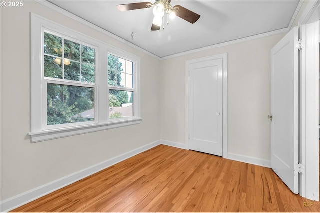 3700 NE Maywood Pl, Portland, OR 97220 - unfurnished bedroom with baseboards, light wood-style flooring, ornamental molding, a ceiling fan, and a closet
