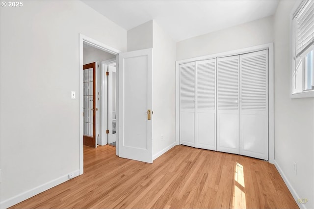 3700 NE Maywood Pl, Portland, OR 97220 - unfurnished bedroom with light wood finished floors, baseboards, and a closet