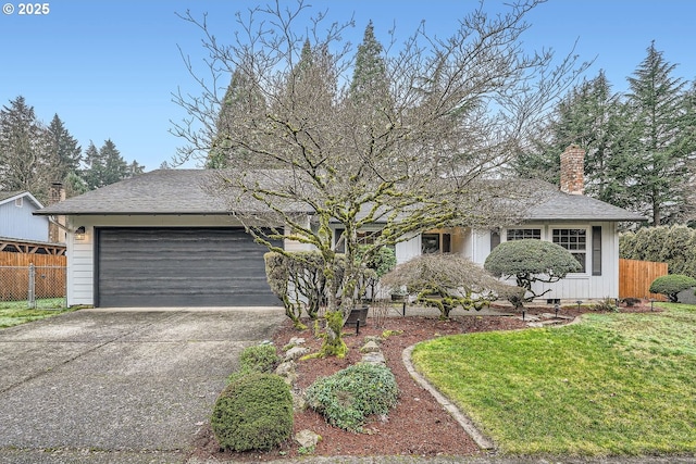 single story home with a front yard and a garage