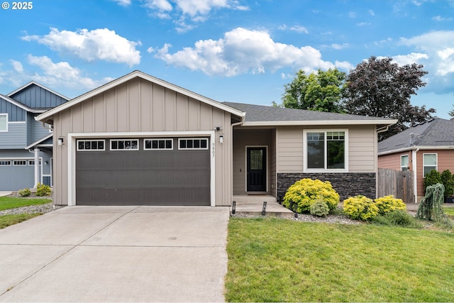 5807 NE 77th Cir, Vancouver, WA 98661 - view of front of house with a garage, driveway, stone siding, and board and batten siding
