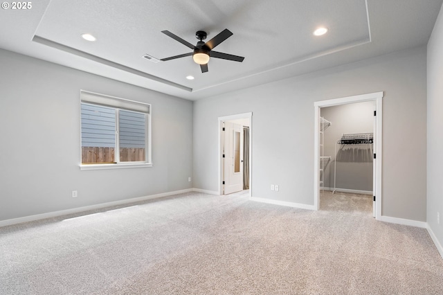 5807 NE 77th Cir, Vancouver, WA 98661 - unfurnished bedroom featuring a raised ceiling, light carpet, recessed lighting, a walk in closet, and a closet