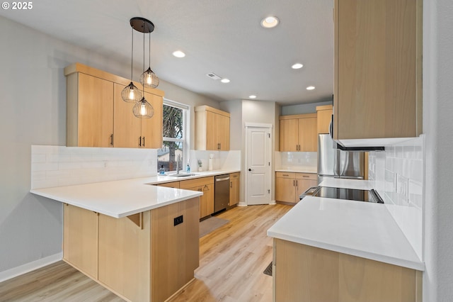 5807 NE 77th Cir, Vancouver, WA 98661 - kitchen with stainless steel dishwasher, light brown cabinets, tasteful backsplash, a peninsula, and stove