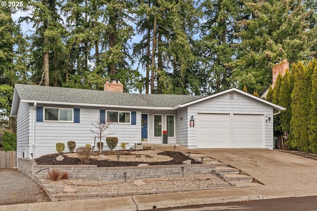 ranch-style home featuring a garage