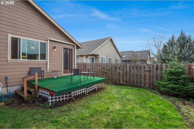 view of yard featuring a fenced backyard and a wooden deck