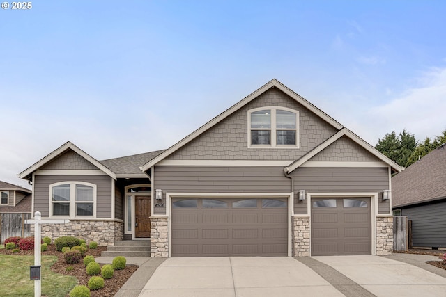 4506 NE 121st St, Vancouver, WA 98686 - craftsman-style home featuring stone siding, driveway, fence, and an attached garage