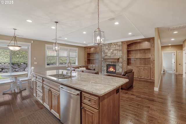 4506 NE 121st St, Vancouver, WA 98686 - kitchen with a sink, stainless steel dishwasher, dark wood finished floors, a kitchen island with sink, and light stone countertops