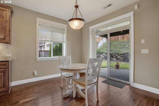 4506 NE 121st St, Vancouver, WA 98686 - dining space with healthy amount of natural light, dark wood-style floors, and baseboards