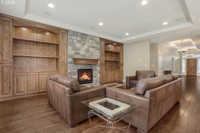 4506 NE 121st St, Vancouver, WA 98686 - living area with a stone fireplace, ornamental molding, wood finished floors, a chandelier, and recessed lighting