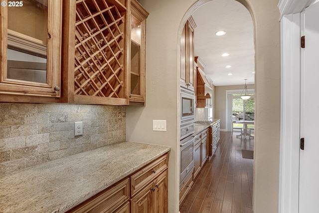 4506 NE 121st St, Vancouver, WA 98686 - kitchen featuring stainless steel oven, backsplash, recessed lighting, built in microwave, and light stone countertops