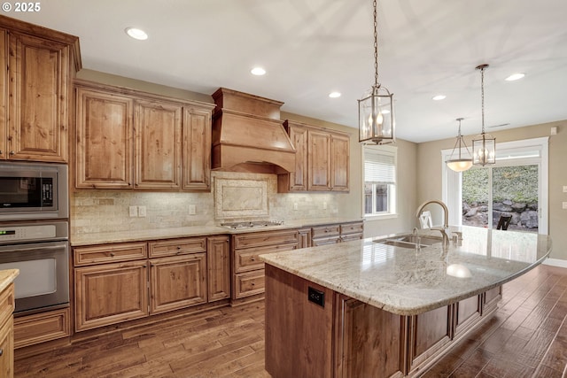 4506 NE 121st St, Vancouver, WA 98686 - kitchen with appliances with stainless steel finishes, a sink, premium range hood, dark wood-type flooring, and recessed lighting