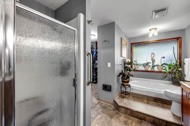 full bath with a stall shower, a bath, baseboards, and vanity