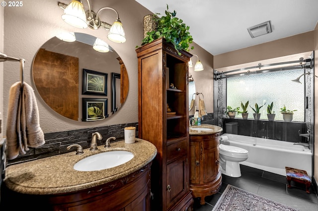 bathroom with vanity, toilet, tile patterned floors, a textured wall, and combined bath / shower with glass door