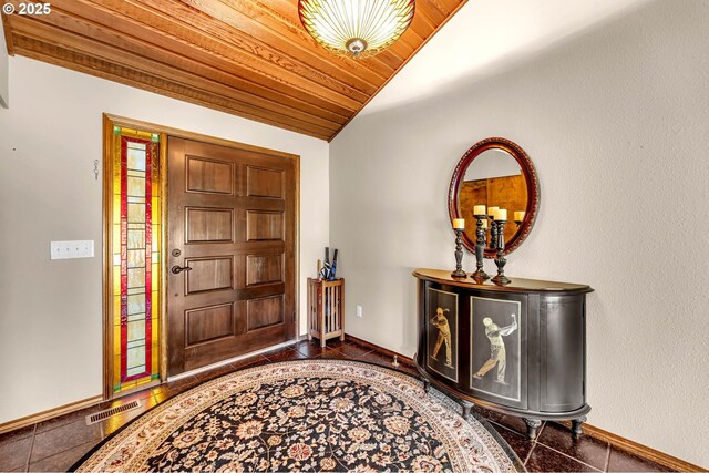 entryway featuring lofted ceiling, wood ceiling, and baseboards
