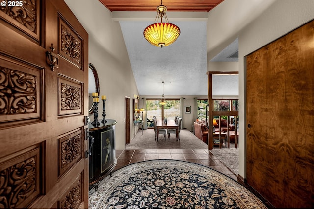 foyer entrance with high vaulted ceiling