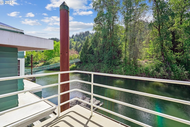 balcony featuring a water view