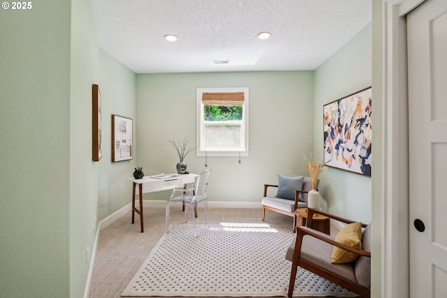 living area with light carpet, baseboards, visible vents, and recessed lighting