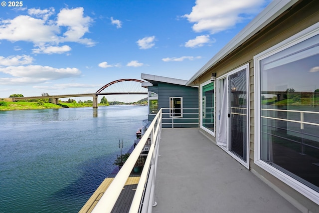 balcony featuring a water view