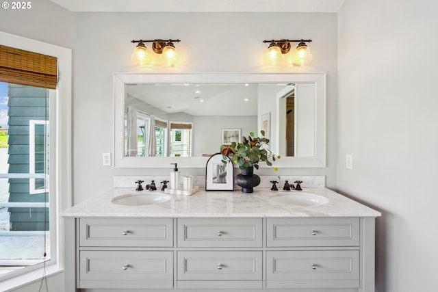 full bath featuring double vanity and a sink
