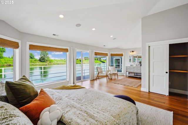 bedroom with vaulted ceiling, multiple windows, visible vents, and recessed lighting