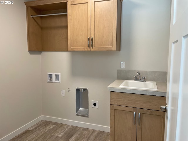 7863 SW Thornbridge Ter Unit 11, Beaverton, OR 97007 - laundry area with hookup for an electric dryer, cabinet space, hookup for a washing machine, wood finished floors, and baseboards