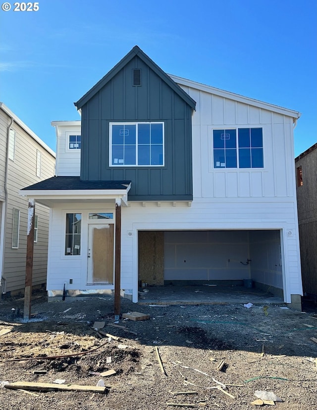 modern farmhouse style home with board and batten siding and an attached garage