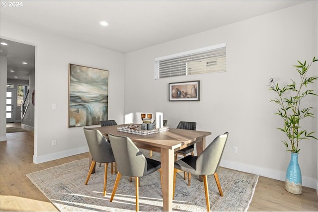 dining space with light wood-type flooring