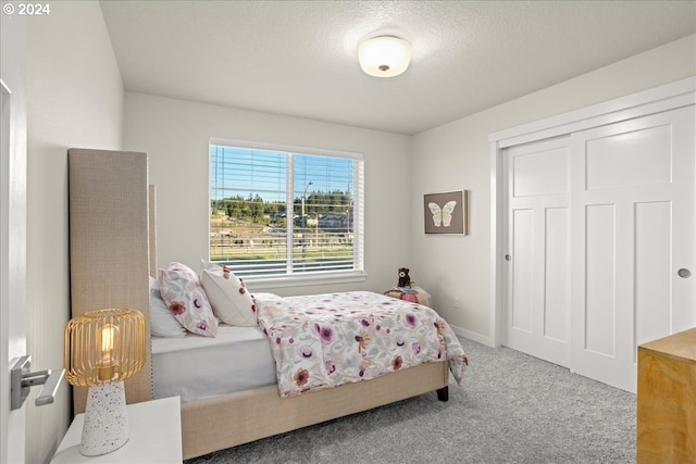 carpeted bedroom featuring a closet