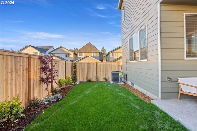 view of yard with central AC unit