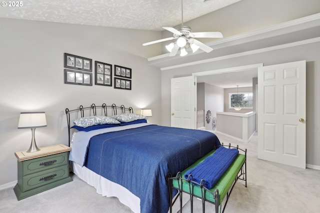 bedroom featuring lofted ceiling, a textured ceiling, ceiling fan, and carpet