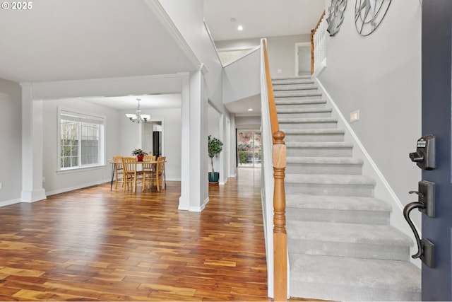 16374 SE Orchard View Ln, Damascus, OR 97089 - entryway featuring a chandelier, plenty of natural light, wood finished floors, stairs, and a towering ceiling