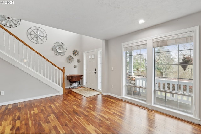 foyer entrance featuring wood-type flooring