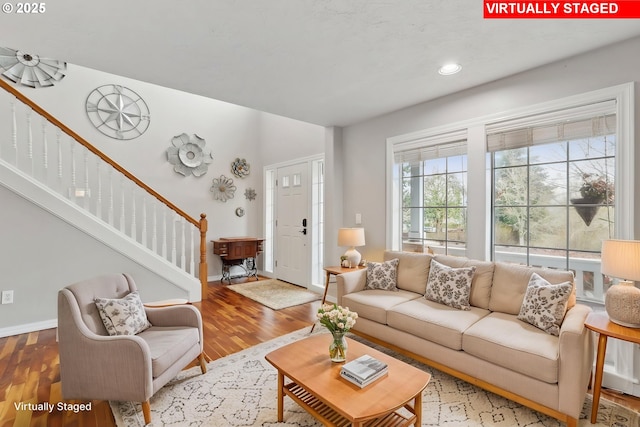 16374 SE Orchard View Ln, Damascus, OR 97089 - living room with wood finished floors, stairs, baseboards, and recessed lighting