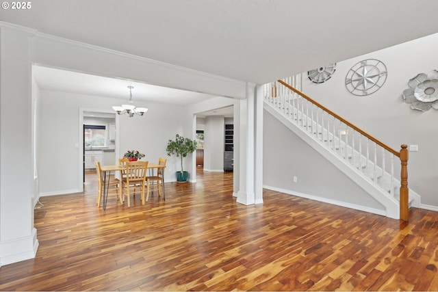 16374 SE Orchard View Ln, Damascus, OR 97089 - dining area with stairway, wood finished floors, a chandelier, and baseboards