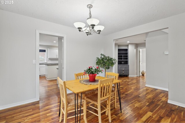 16374 SE Orchard View Ln, Damascus, OR 97089 - dining space featuring a chandelier, wood finished floors, baseboards, recessed lighting, and a textured ceiling