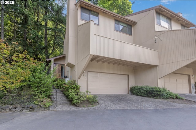 540 Montara Way, Eugene, OR 97405 - view of front of home featuring a chimney, an attached garage, and driveway