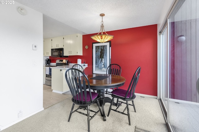 540 Montara Way, Eugene, OR 97405 - dining space featuring an accent wall, light carpet, and a textured ceiling