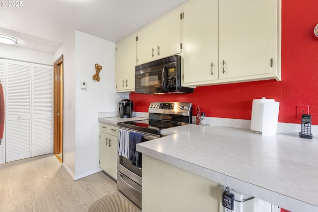 540 Montara Way, Eugene, OR 97405 - kitchen featuring stainless steel electric range oven, black microwave, light countertops, and light wood-style flooring