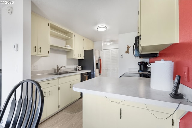 540 Montara Way, Eugene, OR 97405 - kitchen with light countertops, a peninsula, stainless steel fridge with ice dispenser, stove, and black dishwasher