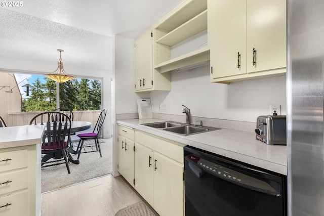 540 Montara Way, Eugene, OR 97405 - kitchen with black dishwasher, freestanding refrigerator, light countertops, hanging light fixtures, and open shelves