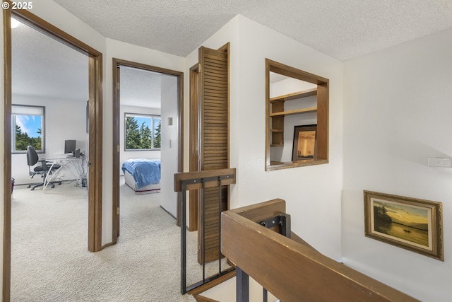 540 Montara Way, Eugene, OR 97405 - hall with light colored carpet, plenty of natural light, an office area, and a textured ceiling