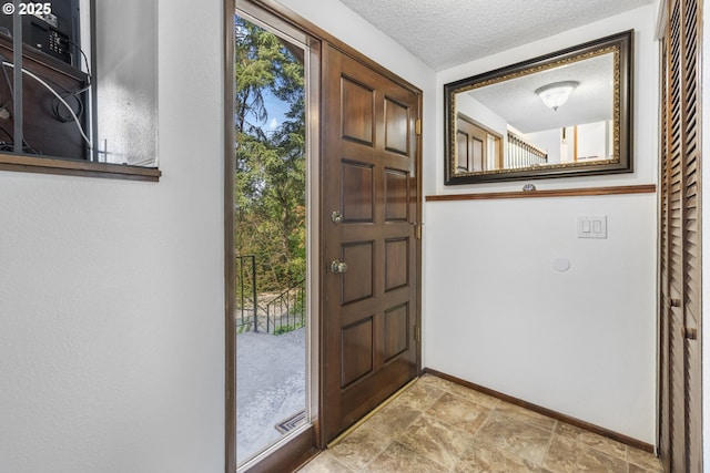 540 Montara Way, Eugene, OR 97405 - entryway with stone finish flooring and a textured ceiling