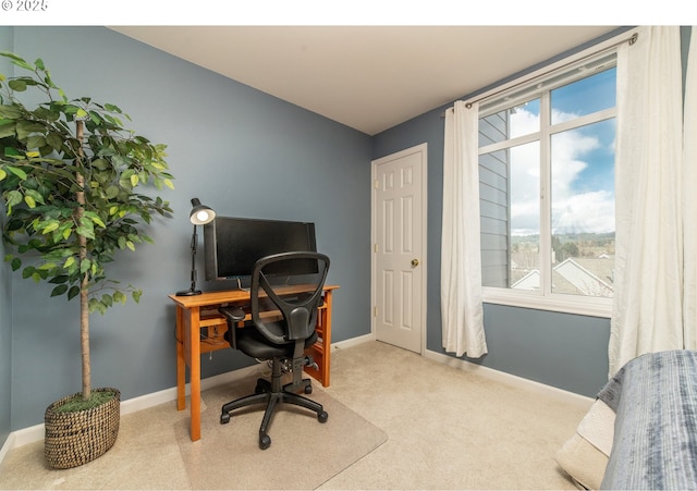 office area with a wealth of natural light, baseboards, and carpet flooring