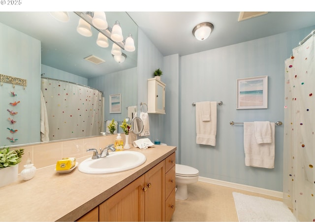 full bathroom featuring vanity, toilet, baseboards, and visible vents