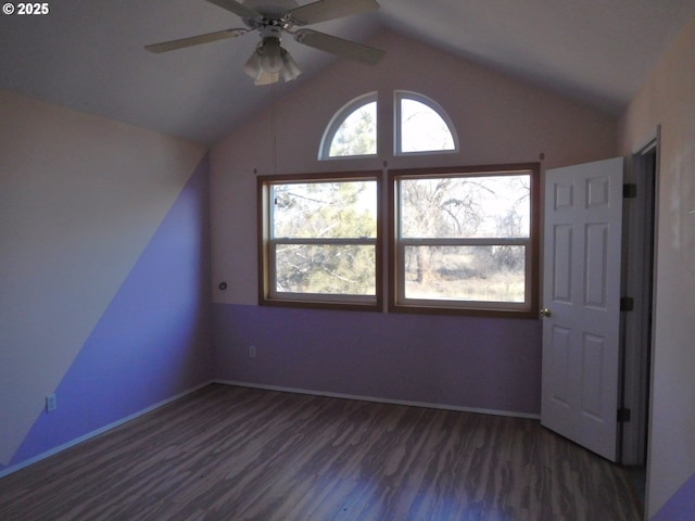 additional living space with vaulted ceiling, dark wood-type flooring, and ceiling fan