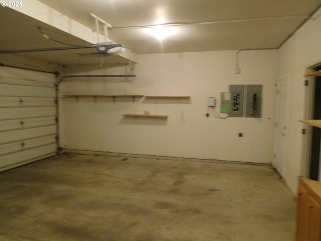 garage with a garage door opener and electric panel