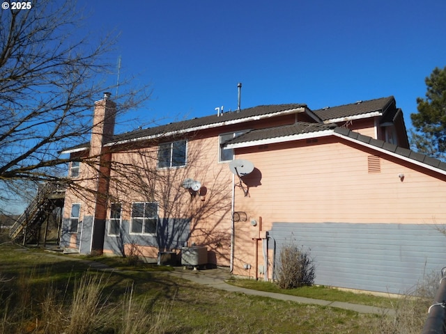 view of side of home with cooling unit