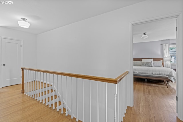5707 SW Menefee Dr, Portland, OR 97239 - hallway featuring light wood-type flooring and an upstairs landing