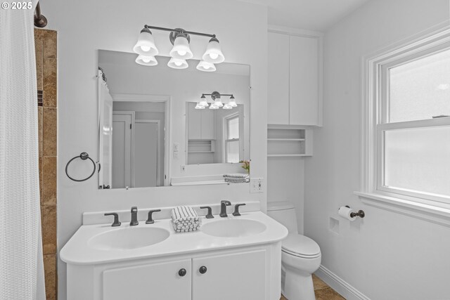 5707 SW Menefee Dr, Portland, OR 97239 - full bathroom with double vanity, a chandelier, and curtained shower